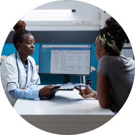 A healthcare professional talking to another person