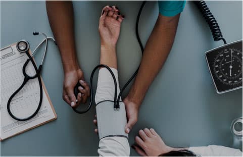 nurse-measuring-patient-blood-pressure